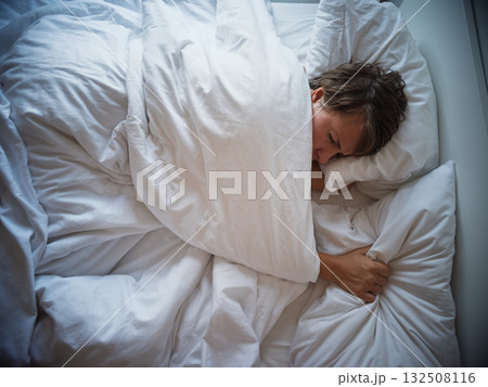 Lonely 35 year old woman sleeping alone after breakup, sadness and emotional emptiness  132508116