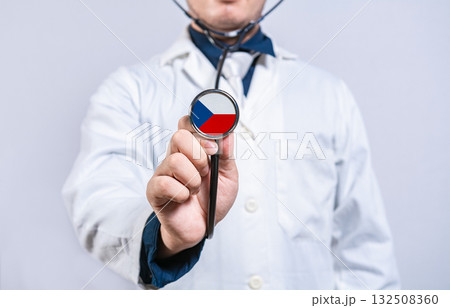 Doctor holding stethoscope with czech flag. Czech health and care concept 132508360