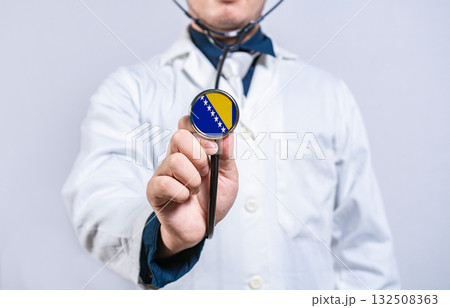 Doctor holding stethoscope with bosnian flag. Bosnia health and care concept 132508363