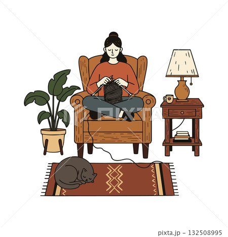 Woman knitting in cozy armchair with cat sleeping on rug and warm lamp light 132508995