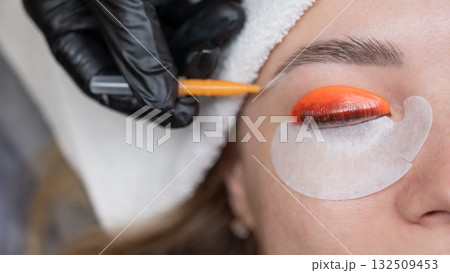 Caucasian woman undergoing eyelash lamination procedure. Caucasian woman undergoing eyelash lamination procedure. 132509453