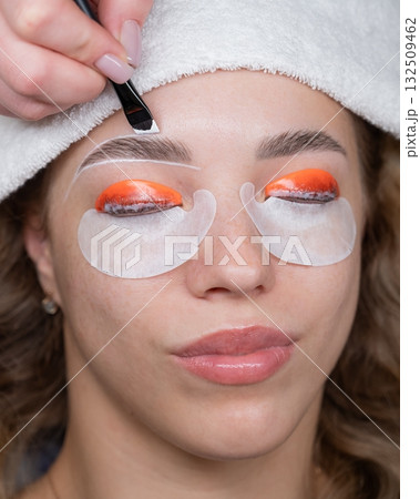 The process of professional lamination and dyeing of eyelashes and eyebrows in the salon. The process of professional lamination and dyeing of eyelashes and eyebrows in the salon. 132509462