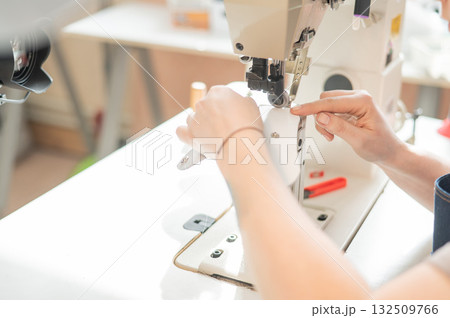 Woman tanner at work in the workshop. Woman tanner at work in the workshop. 132509766