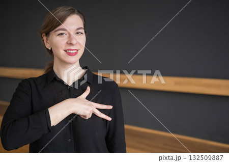 Caucasian woman showing the phrase social work in sign language. Caucasian woman showing the phrase social work in sign language. 132509887