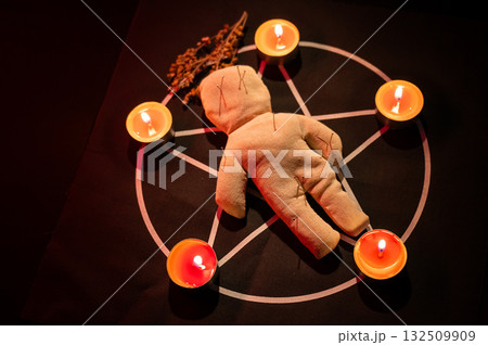 Voodoo doll on a pentagram. Witch spells. 132509909