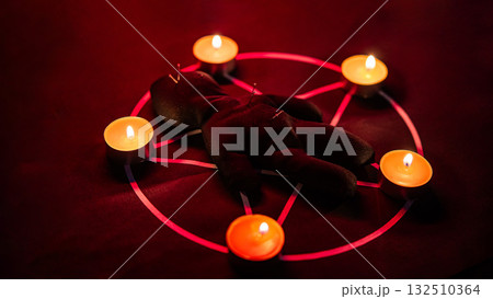 Voodoo doll on a pentagram. Witch spells. Voodoo doll on a pentagram. Witch spells. 132510364
