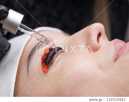The process of professional lamination and tinting of eyelashes in the salon. The process of professional lamination and tinting of eyelashes in the salon. 132510561