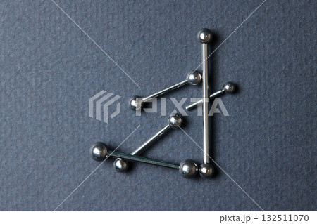 Piercing earrings close-up. On a black background. Piercing earrings close-up. On a black background. 132511070