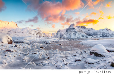 Astonishing Flakstadpollen and Boosen fjords with cracks on ice during sunrise Astonishing Flakstadpollen and Boosen fjords with cracks on ice during sunrise 132511339