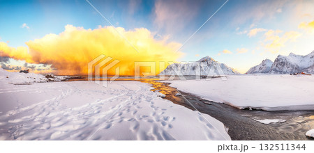 Amazing winter scenery on Skagsanden beach with illuminated clouds during sunrise 132511344