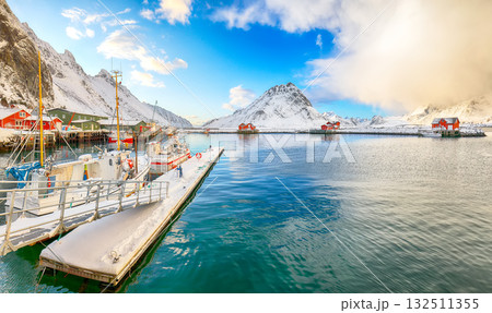 Breathtaking winter sunrise over Ramberg village and harbour. 132511355