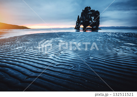 Ribbed dark sand after the tide. Location place Hvitserkur, Iceland, Europe. 132511521
