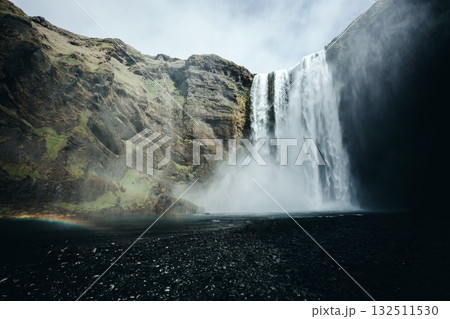 Amazing view of popular tourist attraction. Location Skogafoss waterfall, Iceland, Europe. Amazing view of popular tourist attraction. Location Skogafoss waterfall, Iceland, Europe. 132511530