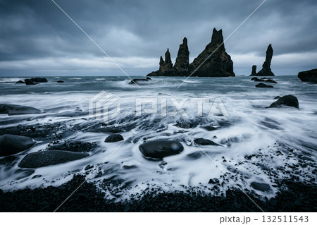 Reynisdrangar basalt rocks or "Troll toes". Location Reynisfjara Beach, Atlantic ocean, Iceland, Europe. Reynisdrangar basalt rocks or "Troll toes". Location Reynisfjara Beach, Atlantic ocean, Iceland, Europe. 132511543
