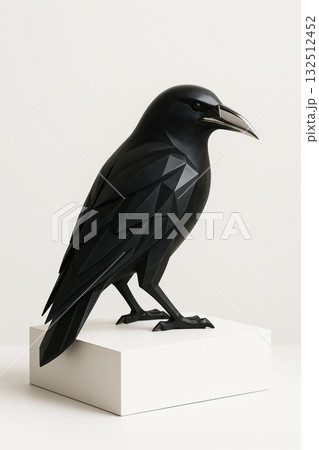 Geometric black raven sculpture on white pedestal 132512452