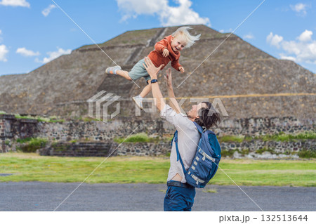 Father with his little toddler son as tourists in front of the pyramids of Teotihuacan in Mexico, enjoying sightseeing, family bonding, and cultural heritage 132513644