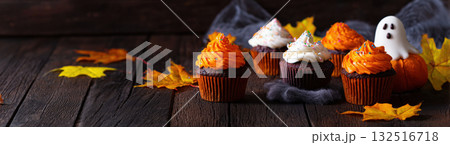 Spooky fall cupcakes with color, created with AI 132516718