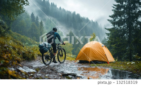 Mountain biker finds shelter in the rain. Mountain biker finds shelter in the rain. 132518319