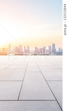 Featuring empty square floor tiles alongside a modern city skyline panorama in shanghai, china, during sunset, creating an ideal backdrop for car advertising and promotions 132518844