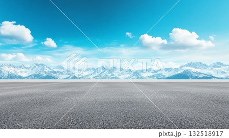 Featuring an empty asphalt road stretching through a winter landscape, showcasing majestic snow capped mountains under a bright blue sky, inviting a sense of adventure and freedom Featuring an empty asphalt road stretching through a winter landscape, showcasing majestic snow capped mountains under a bright blue sky, inviting a sense of adventure and freedom 132518917