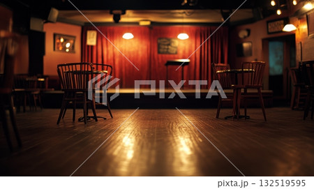 empty chairs in a dimly lit bar with stage 132519595