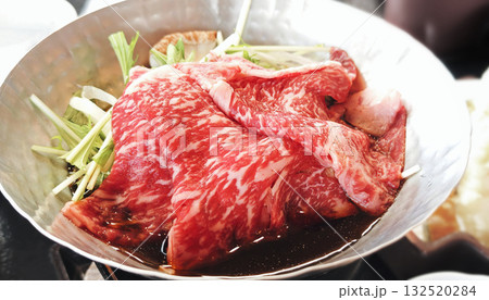 Close-up of Japanese sukiyaki showing rich broth and fresh ingredients 132520284