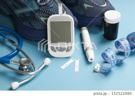 Diabetes kit, stethoscope, and shoes neatly arranged Diabetes kit, stethoscope, and shoes neatly arranged 132522080