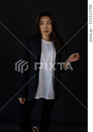 Editorial style image capturing clothing textures with poised model and gentle illumination 132523706