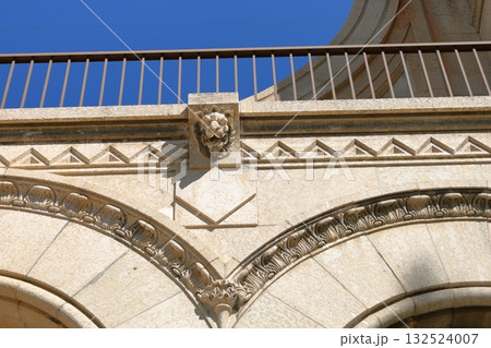 Historic stone arches with ornate details 132524007