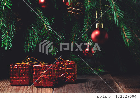 Red gifts under the Christmas tree Red gifts under the Christmas tree 132525604