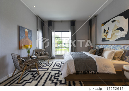 Stylish pale green and white bedroom in the master suite. 132526134