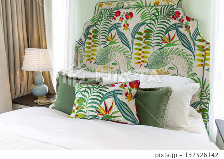 Stylish pale green and white bedroom in the master suite. Stylish pale green and white bedroom in the master suite. 132526142