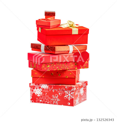 Stack of red and gold gift boxes decorated with ribbons and bows, symbolizing celebration, joy, and holiday spirit, isolated on white background 132526343
