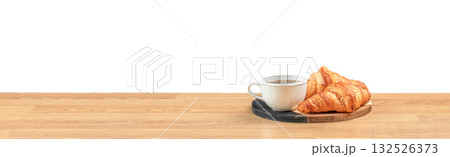 Minimalist morning concept with hot coffee and fresh croissants on a wooden table, symbolizing comfort, relaxation, and breakfast simplicity with space for text or design Minimalist morning concept with hot coffee and fresh croissants on a wooden table, symbolizing comfort, relaxation, and breakfast simplicity with space for text or design 132526373