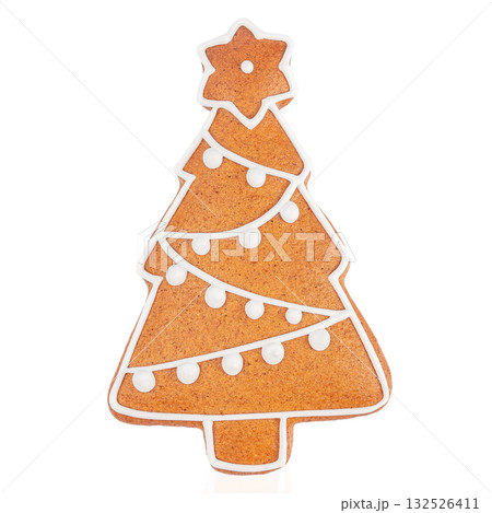 Gingerbread Christmas tree cookie decorated with white icing on white background Gingerbread Christmas tree cookie decorated with white icing on white background 132526411