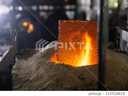 Foundry - ferrous metal is melted in an induction furnace of metallurgical plant 132528629
