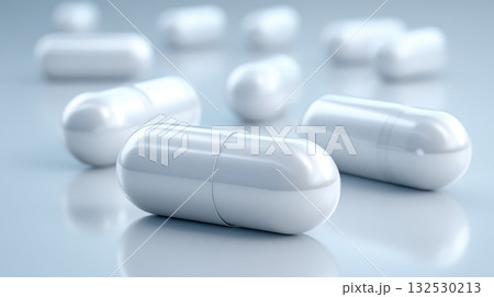 White capsule pharmaceutical drug development concept with close up of medicine pills on reflective surface showing health care and medical treatment White capsule pharmaceutical drug development concept with close up of medicine pills on reflective surface showing health care and medical treatment 132530213