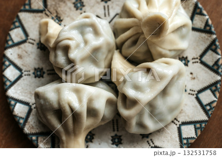 Georgian Khinkali. Traditional Dumplings on Plate 132531758