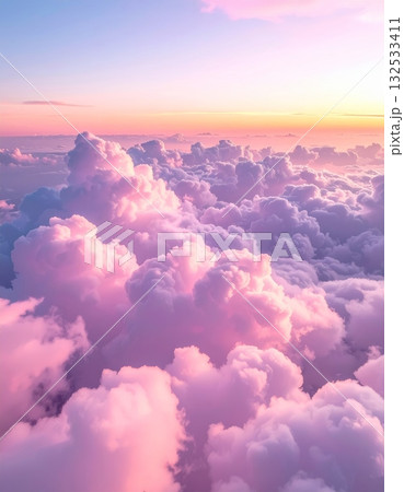 Fluffy white cumulus clouds drift lazily across a brilliant blue sky, a perfect, serene summer day 132533411