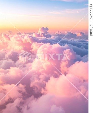 Fluffy white cumulus clouds drift lazily across a brilliant blue sky, a perfect, serene summer day 132533413