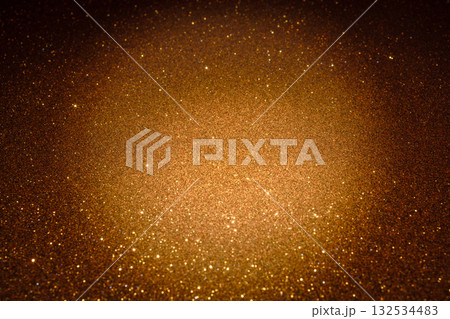 Golden glitter texture sparkling under warm light with glowing highlights and subtle depth Golden glitter texture sparkling under warm light with glowing highlights and subtle depth 132534483
