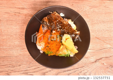 grilled saba fish or mackerel topping crab stick and shrimp egg couple sweet egg on japanese rice in bowl grilled saba fish or mackerel topping crab stick and shrimp egg couple sweet egg on japanese rice in bowl 132537731