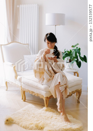 Woman relaxing with tea enjoying cozy hygge lifestyle at home 132539577