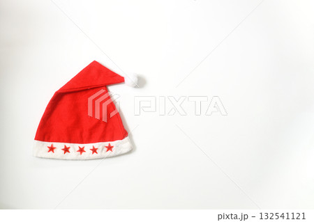 Christmas sparkling Santa Claus hat on white background. Christmas sparkling Santa Claus hat on white background. 132541121