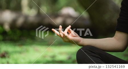 Calm and Peaceful Meditation Pose with Open Palm Gesture in Green Natural Environment for Mindfulness and Relaxation Practices Calm and Peaceful Meditation Pose with Open Palm Gesture in Green Natural Environment for Mindfulness and Relaxation Practices 132541169
