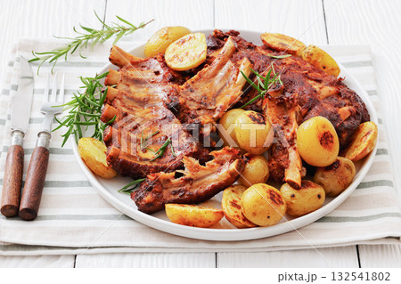 bbq baby pork ribs with potatoes, fresh rosemary 132541802
