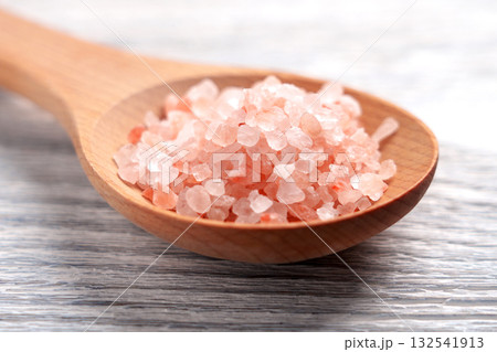 Wooden spoon with pink himalayan salt on white textured rustic table Wooden spoon with pink himalayan salt on white textured rustic table 132541913