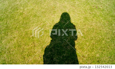 The shadow of a girl in the rural during the daytime at the sunny day. Silhouette people concept. 132542013