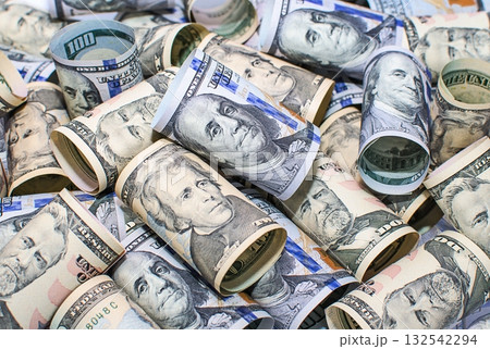 Heap of rolled US dollar banknotes Heap of rolled US dollar banknotes 132542294
