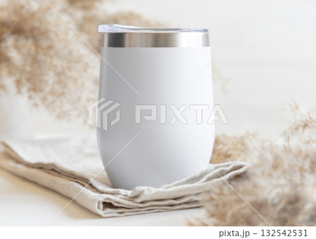 White stainless steel 12oz tumbler on linen near pampas grass Closeup, mockup for print on demand White stainless steel 12oz tumbler on linen near pampas grass Closeup, mockup for print on demand 132542531
